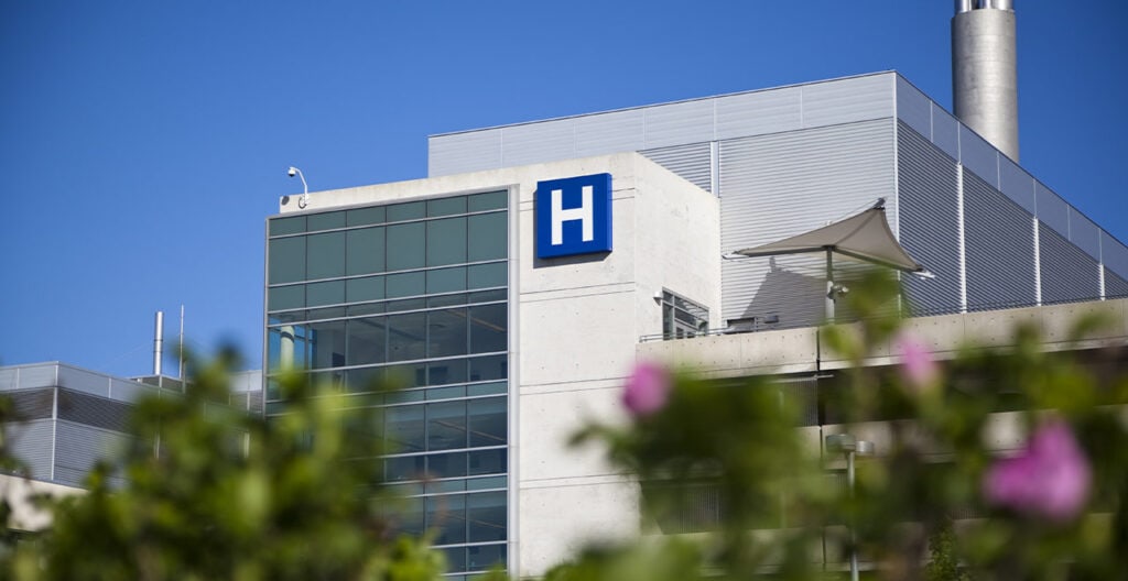 Hospital building with an H sign at REIC Specialty Rentals facility.